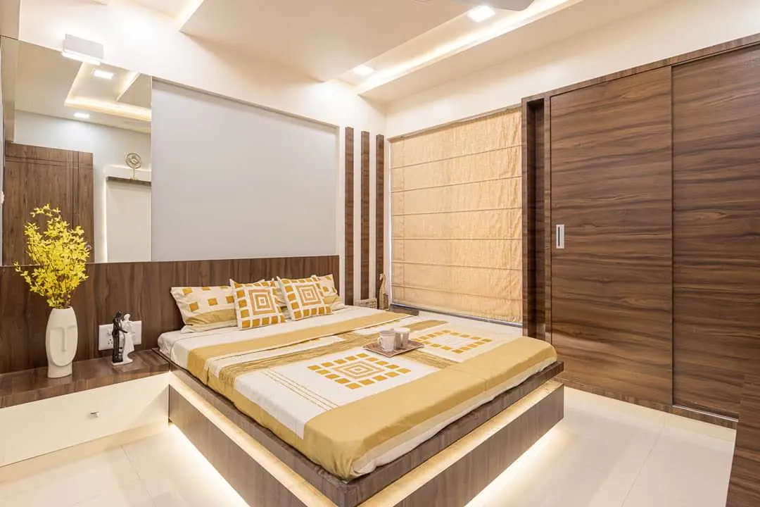 Bedroom with low platform bed and mirror insert headboard panel