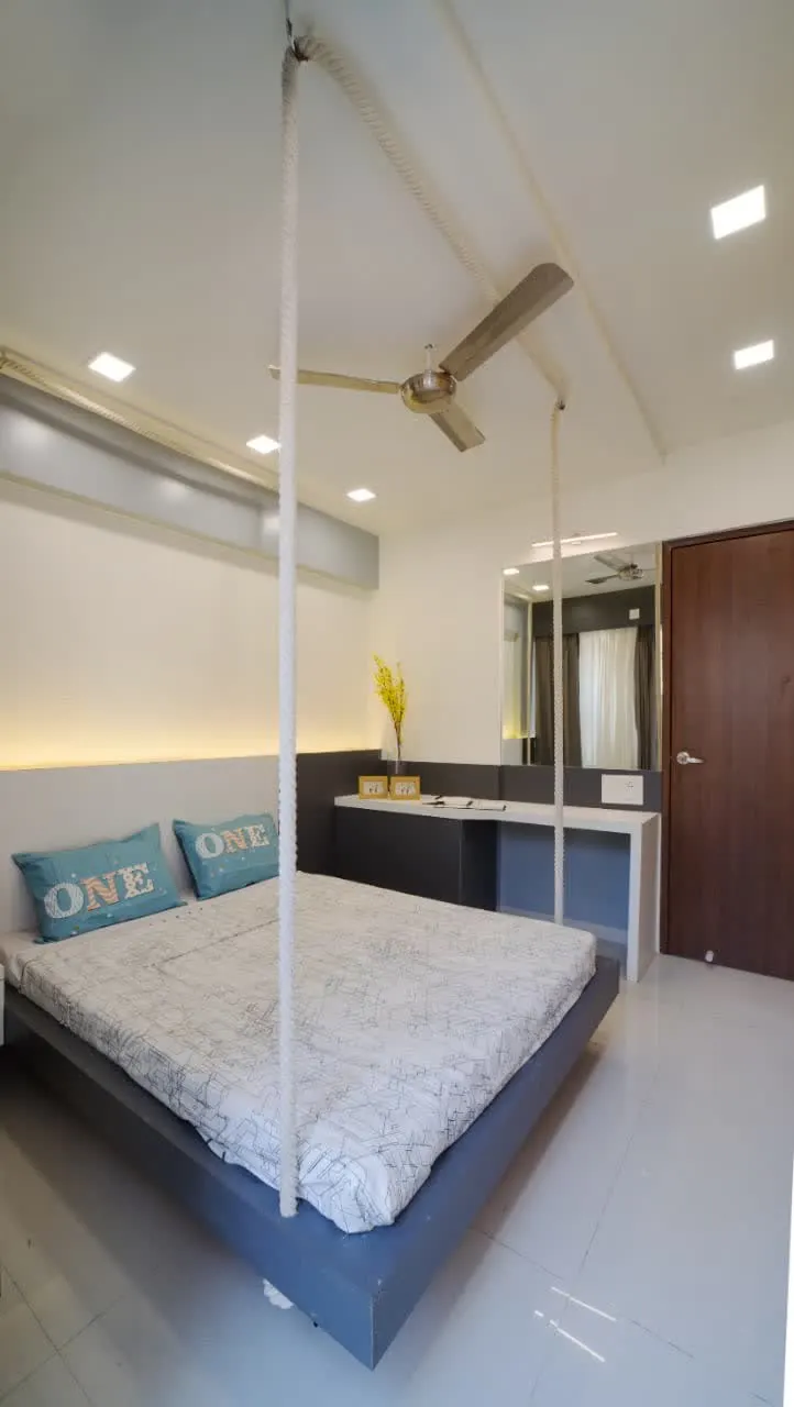 Bedroom with suspended bed and floating dressing table