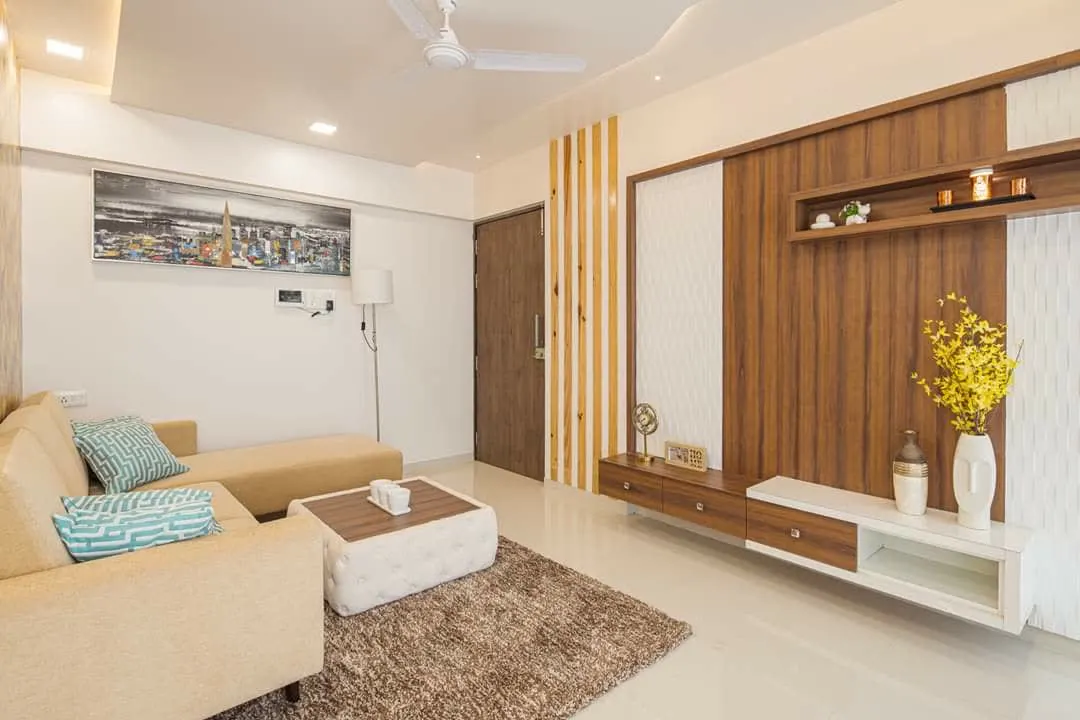 Living room with wooden TV panel and beige sectional sofa